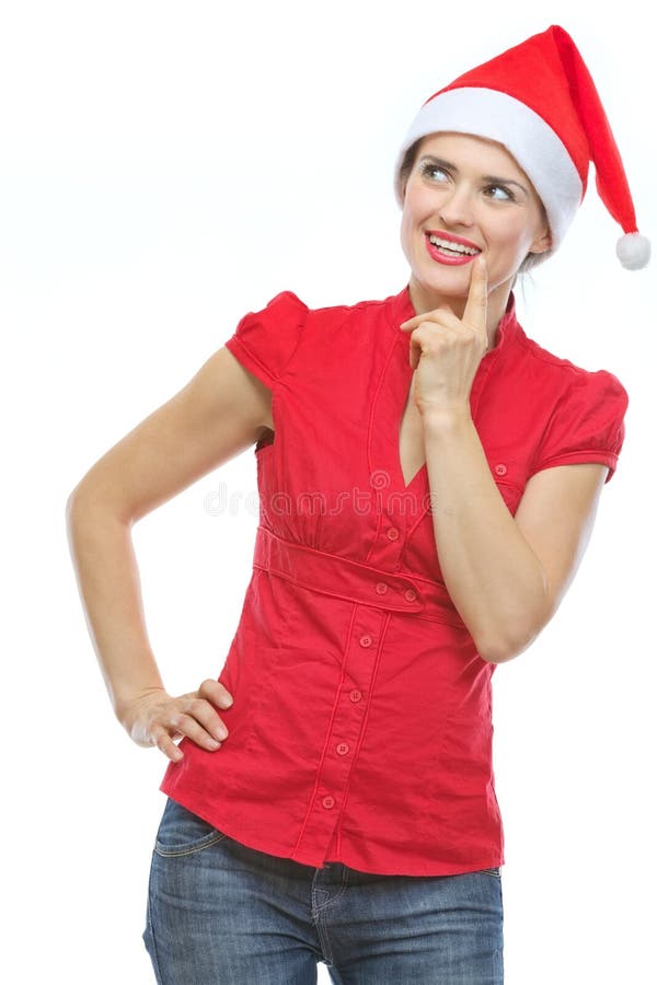 Thoughtful young woman in Christmas hat