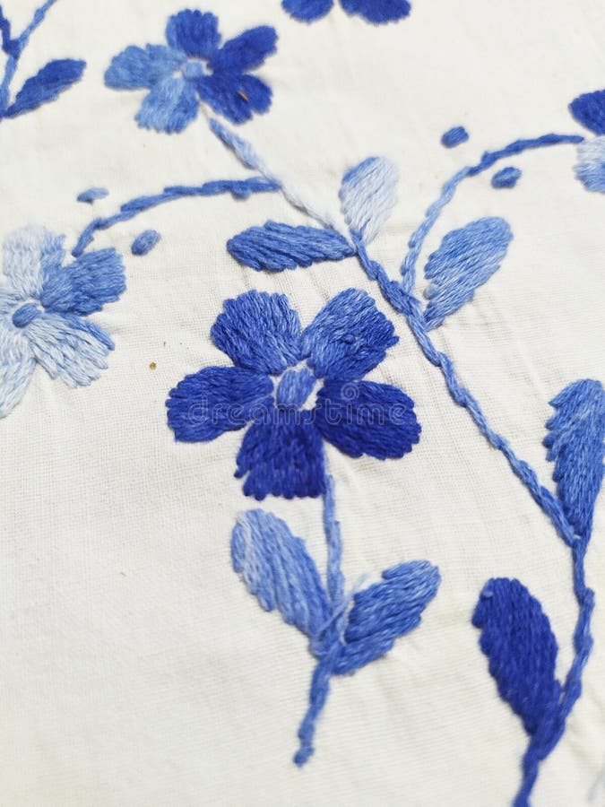 Thread work on bedsheet. Thread work on b, flower, floral, design, pattern, handwork, white, blue, home, decorative, decoration, art, craft