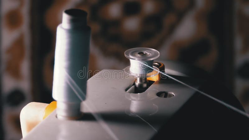 Thread is Wound on a Robbin on Vintage Sewing Machine stock footage