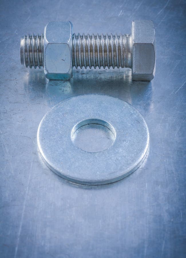 Threaded Bolt Washer Screwbolt Nut on Scratched Metallic Backgro Stock