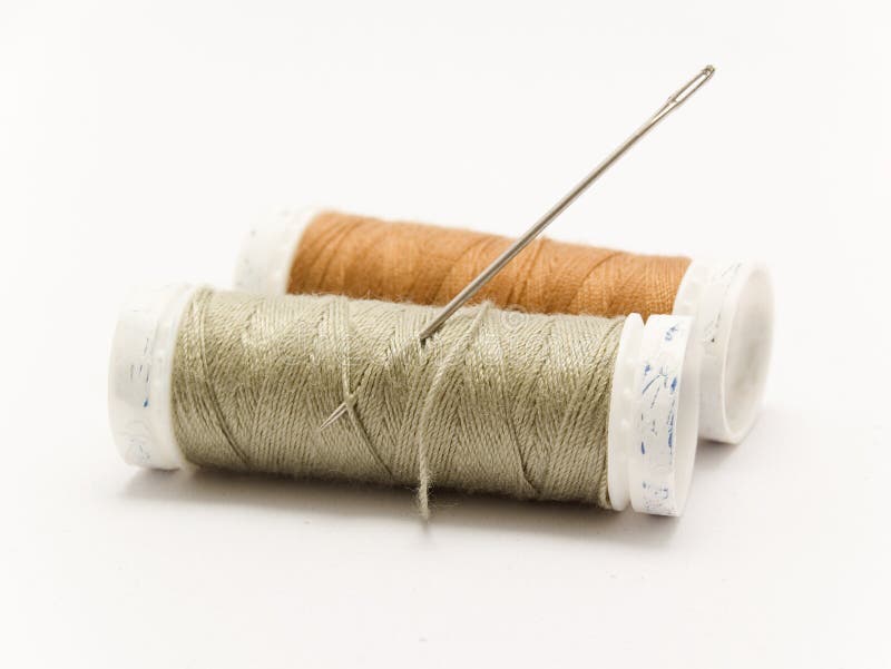 Threaded needle and cotton reel