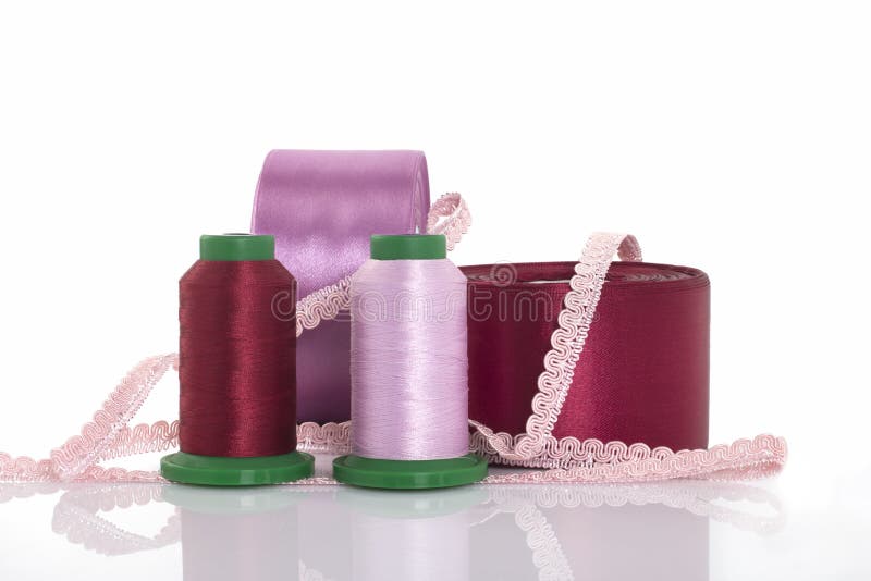 Threads for Embroidery, Satin Ribbons, Sewing Thread and Needlework on a White Background Stock