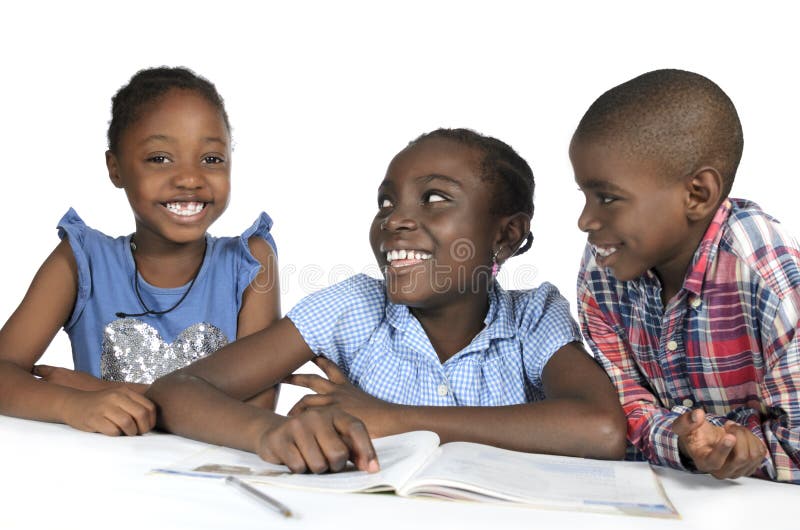 Three african kids playing together on tablet.