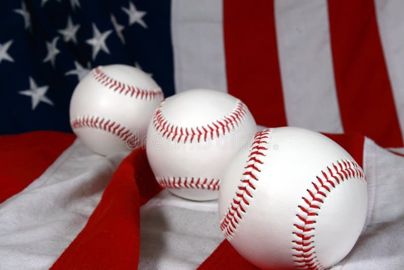 Three baseballs and flag