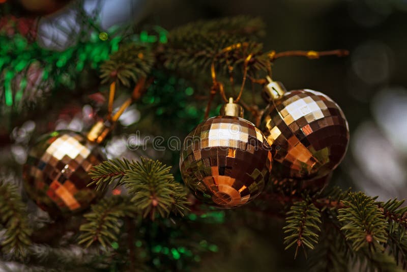 Three Baubles On A Christmas Tree. Three baubles hanging on the Christmas Tree in the Northern Finland. These ornaments are not so traditional. They look almost royalty free stock images Three Baubles On A Christmas Tree. Three baubles hanging on the Christmas Tree in the Northern Finland. These ornaments are not so traditional. They look almost royalty free stock images