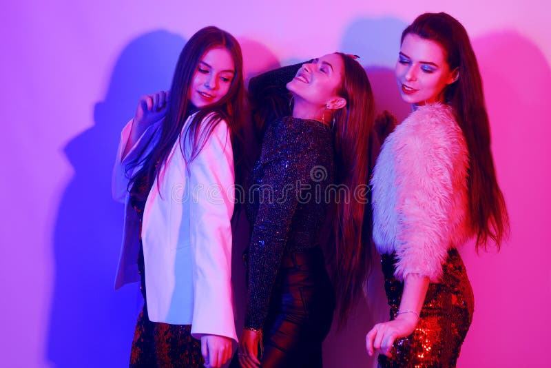 Three Beautiful Girls are Dancing in Neon. an Incredibly Fun Party with ...
