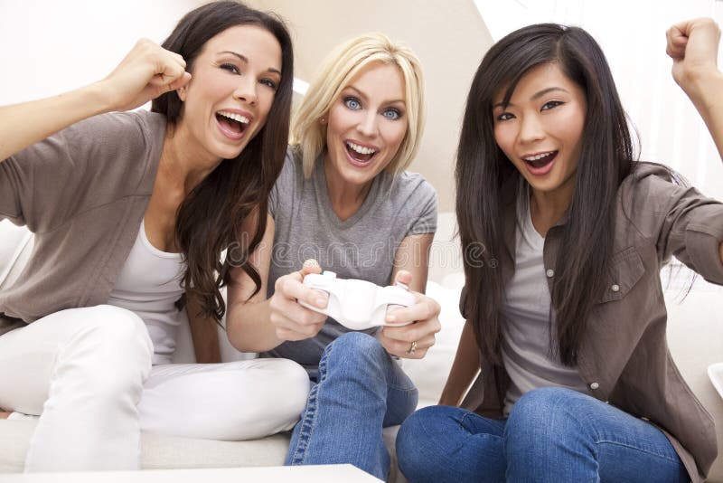 Three Beautiful Women Friends Playing Video Games royalty free stock photo Three Beautiful Women Friends Playing Video Games royalty free stock photo