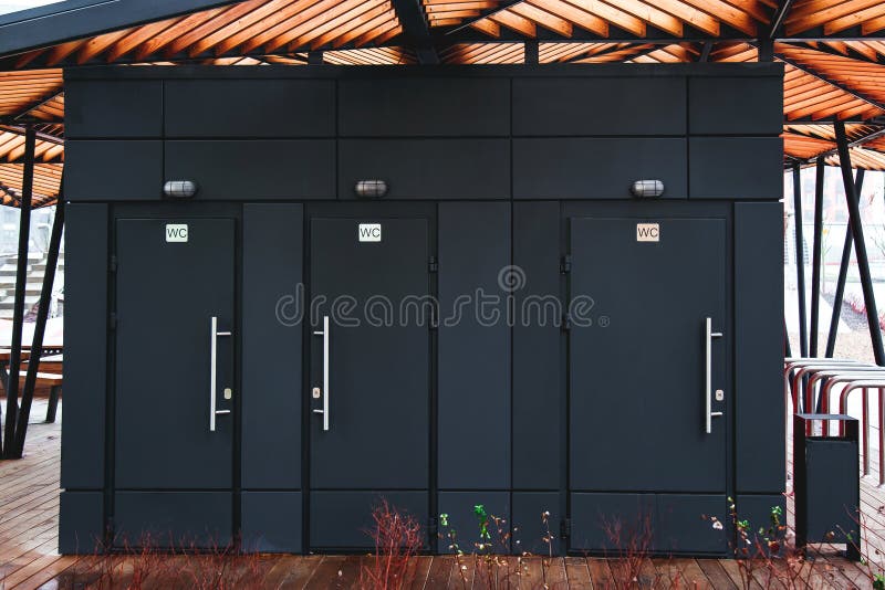 Three Black Public Toilet Doors on the Street 1 Stock Photo Image of
