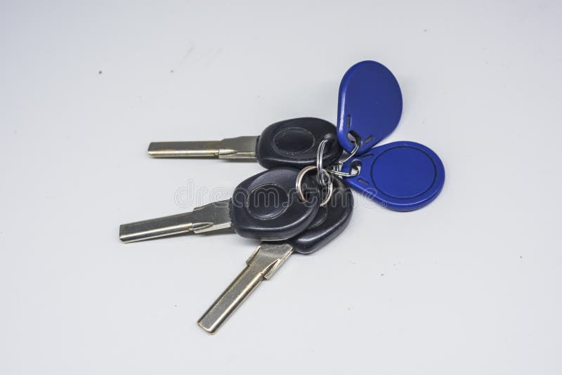 Three Black Room Keys and One Blue Access Card Stock Image Image of