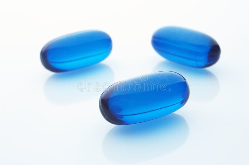 Three blue capsules stock images.