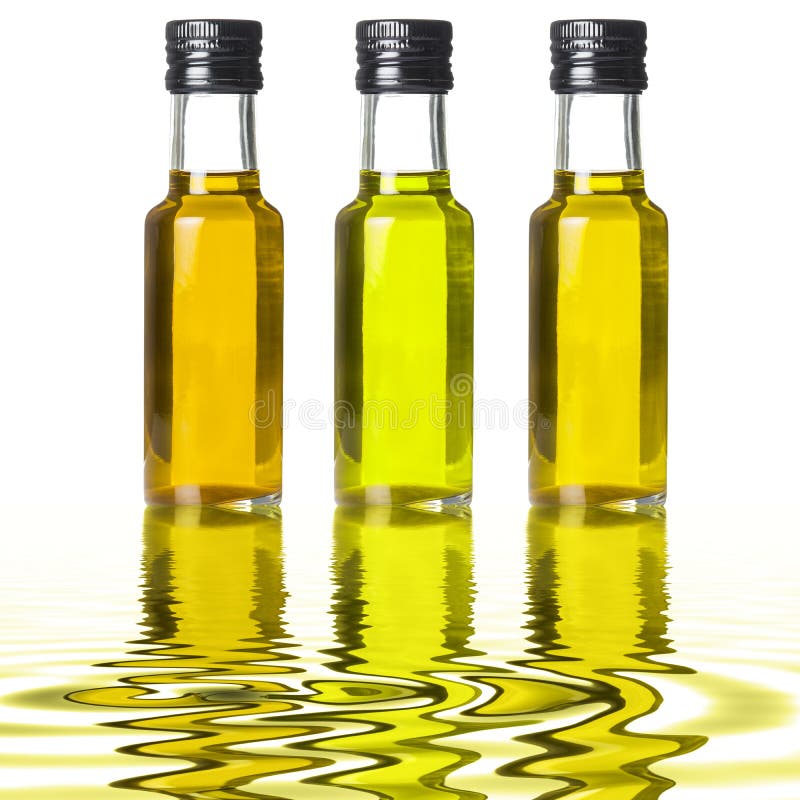 Three olives on olive oil stock image. Image of food 12680513