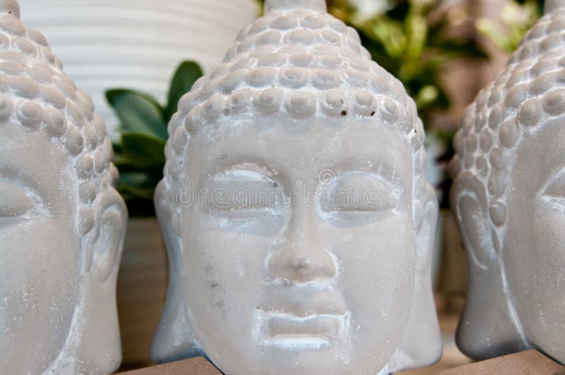 Three Buddha heads