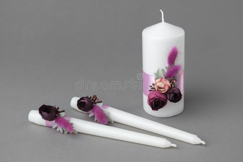 Three candles decorated with beautiful roses royalty free stock images