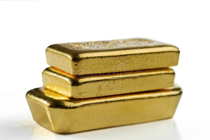 Three cast gold bars are in a pile. Isolated on a white background stock photography Three cast gold bars are in a pile. Isolated on a white background stock photography