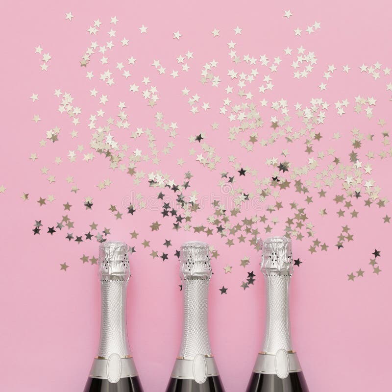 Three Champagne Bottles With Holographic Confetti Stars On ...