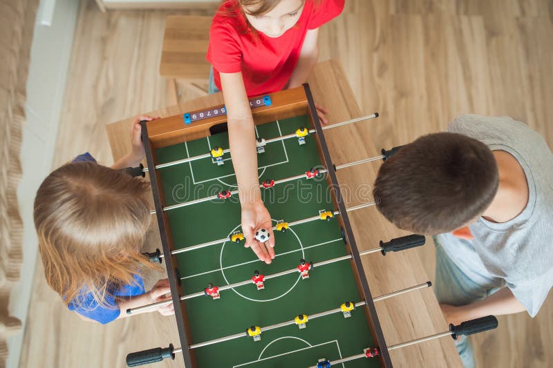 Three Children Play Table Football, Top View Stock Image Image of football, people 186767717