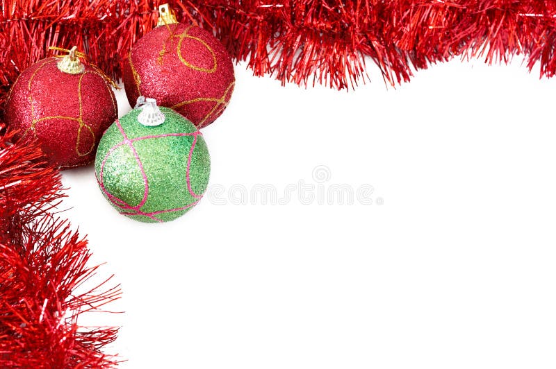 Three Christmas baubles with red tinsel