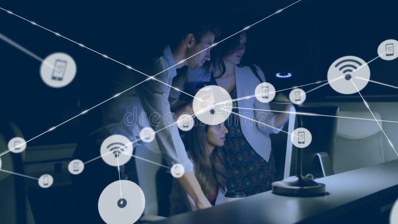 Three colleagues pointing at monitor causing network nodes, icons expanding visualizing network stock video