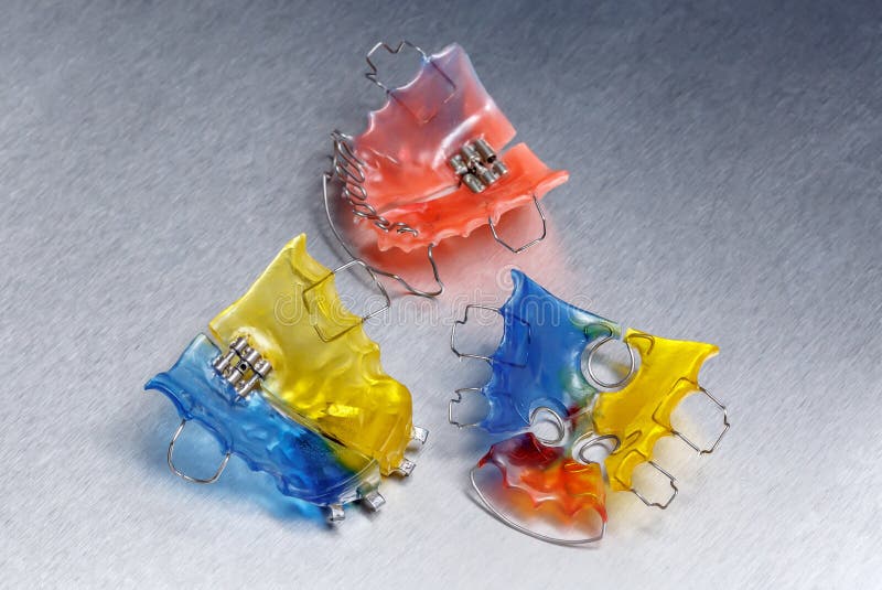 Colorful Dental Braces Or Retainer On Teeth Mold, Clay Human Gums Model  Stock Photo, Picture and Royalty Free Image. Image 101857344.