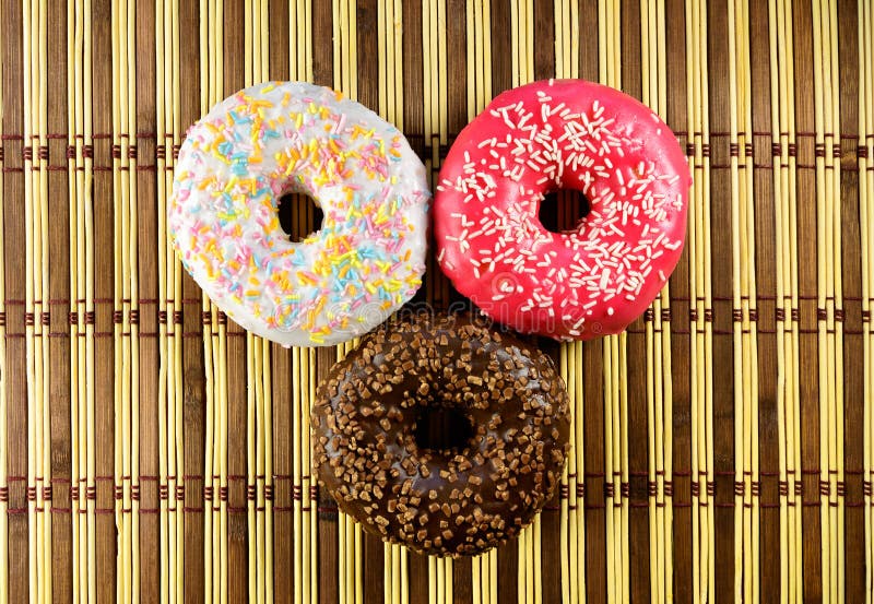 Three colorful donut glaze stock photos