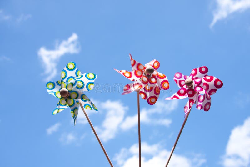 Three colorful windmill toys