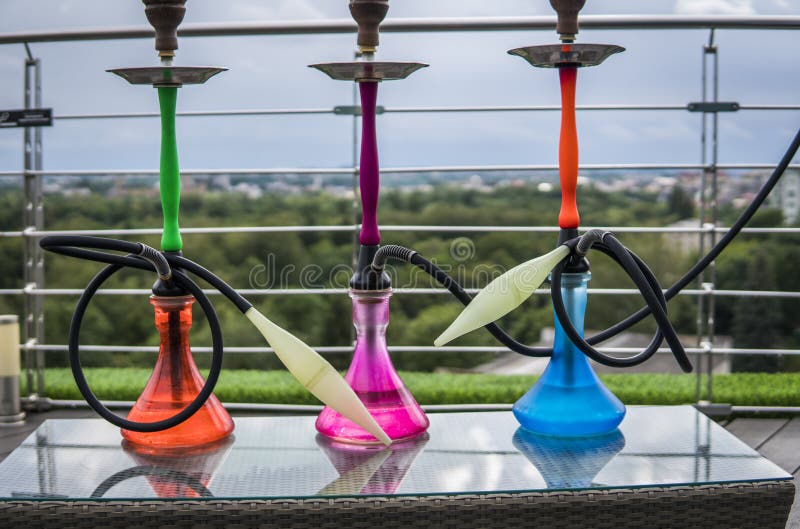 Three Colors Hookahs on Table in Hookah Lounge in a Day. Stock Image