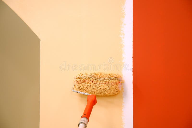 Three colors painting a wall royalty free stock photography