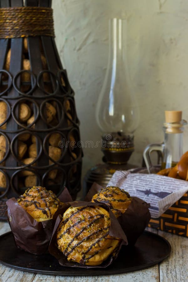 Three crafting muffin with pistachio on an iron tray