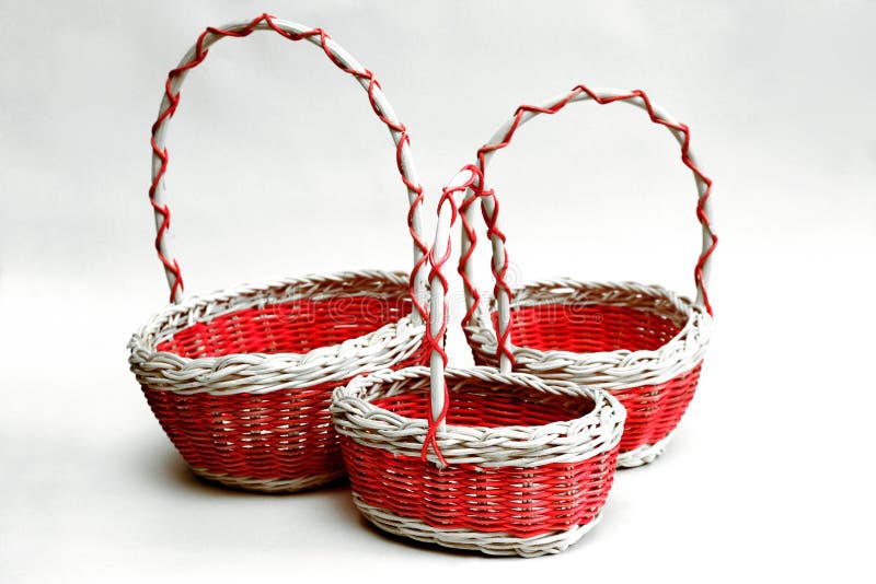 Three Decorative Wicker Baskets of Various Sizes from Vines on a Stock