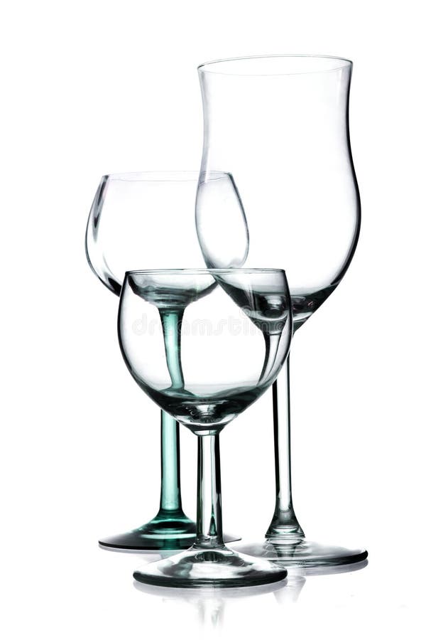 Three different empty wine glasses isolated on a white background