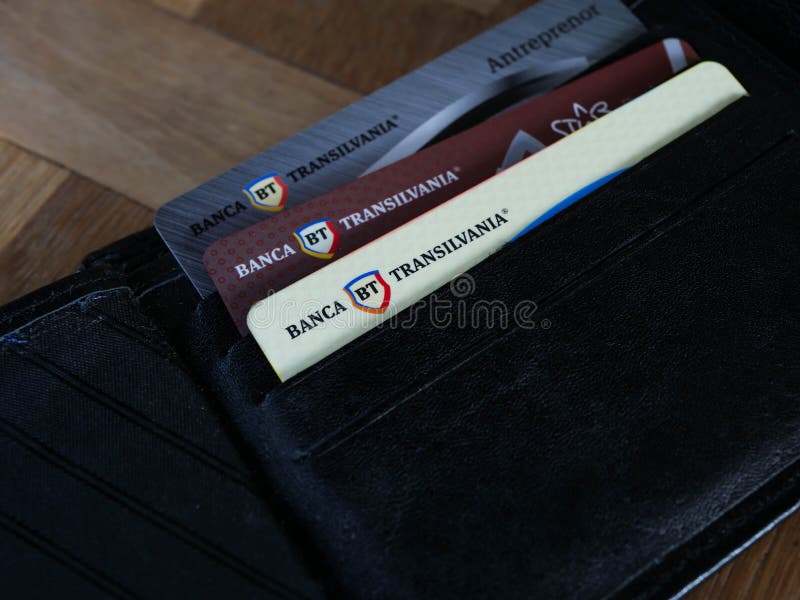 Three different Transilvania Bank plastic cards in a black wallet.