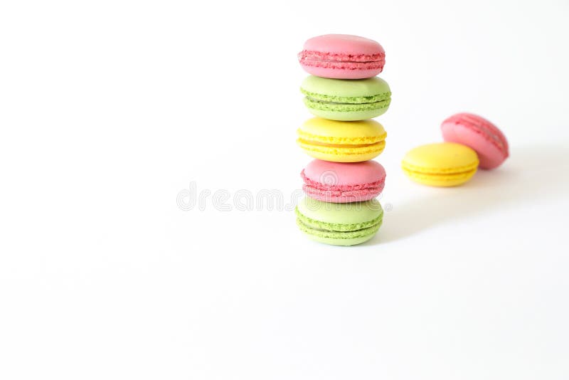 Three different types of macaroons colors pink, green and yellow isolated on white background. royalty free stock photo Three different types of macaroons colors pink, green and yellow isolated on white background. royalty free stock photo