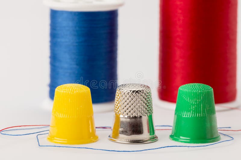 Three Different Types of Thimbles and Spools of Thread in the Ba Stock