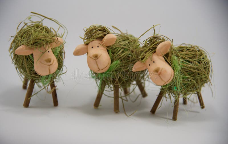 Three Easter decorative straw sheeps royalty free stock photo