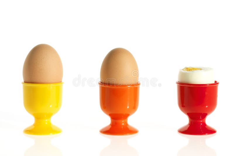 Three Eggs in Colorful Egg Cups Stock Image Image of yellow, meal