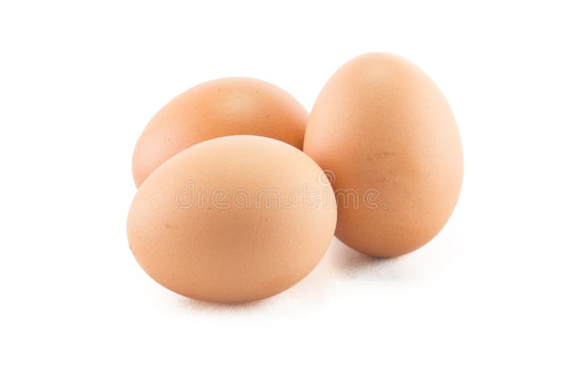 Three eggs are isolated on a white background.