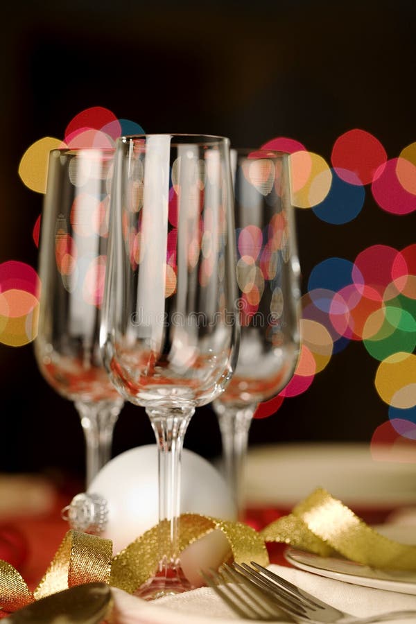 Three empty wine glasses with Christmas theme