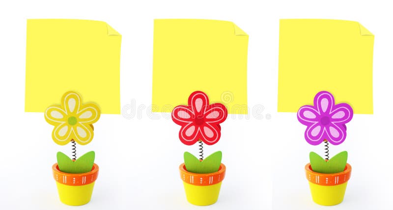 Three flower note holders with empty yellow notes stock images