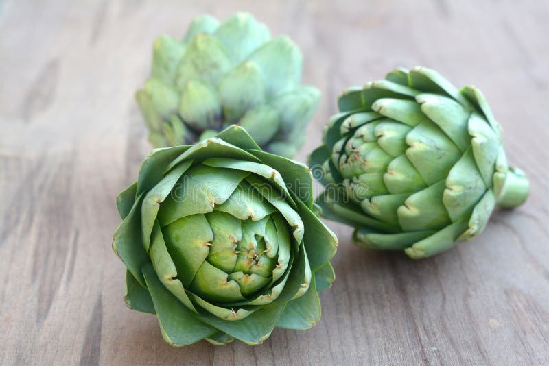 Three fresh artichokes stock image. Image of tradition 63137749