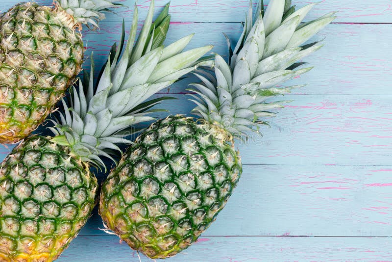 Three fresh green tropical pineapples