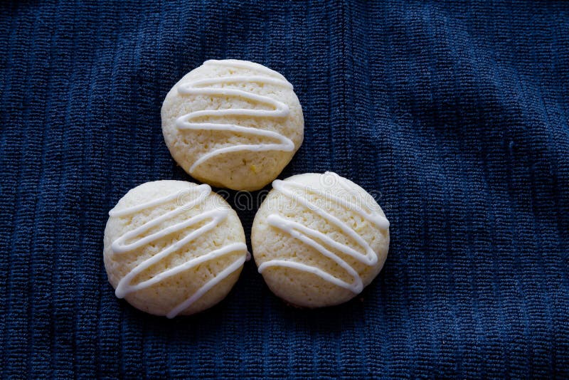 Three Fresh Homemade Lemon Sugar Cookies with Drizzled Icing Stock