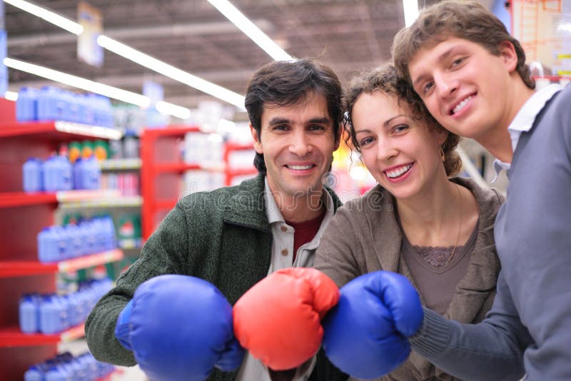 Three friends in boxing gloves