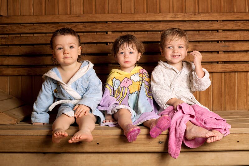 Three funny children in sauna