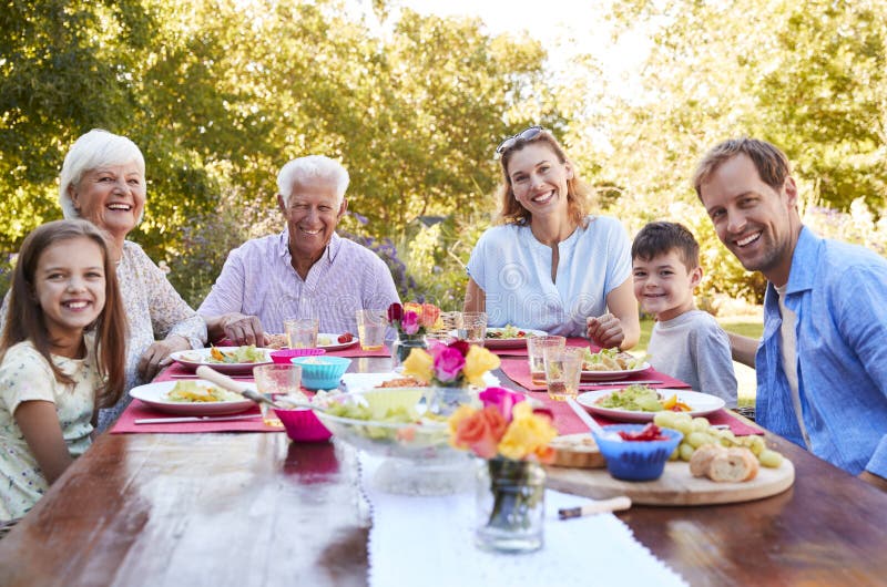 Family and Friends Having a Lunch Party in the Garden Stock Photo ...