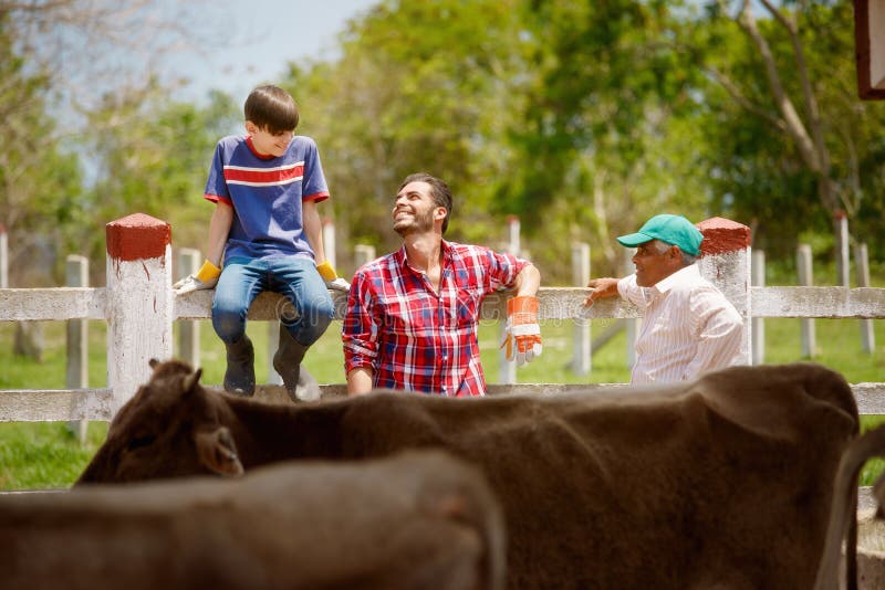 Three Generations Family Of Farmers Laughing In Farm stock photos Three Generations Family Of Farmers Laughing In Farm stock photos
