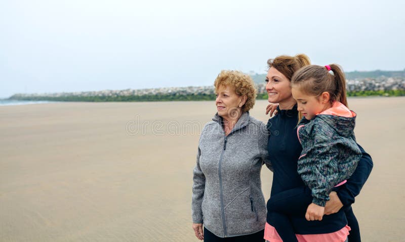 Three generations female looking at sea royalty free stock photos Three generations female looking at sea royalty free stock photos