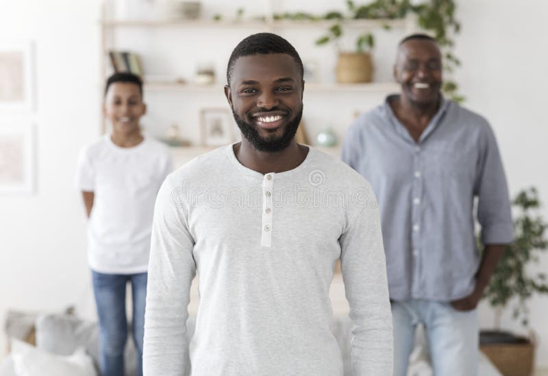 Three Generations. Smiling Black Father, Son And Grandfather Posing Standing At Home stock image Three Generations. Smiling Black Father, Son And Grandfather Posing Standing At Home stock image