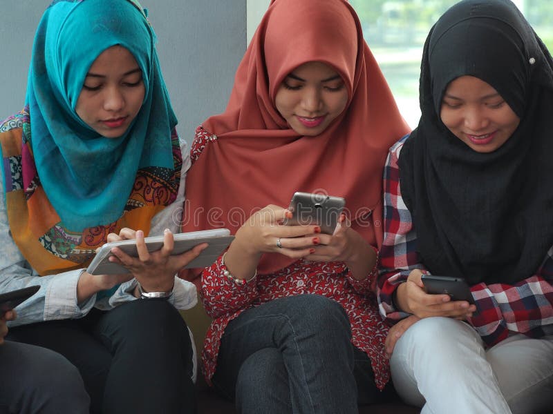 Three Girls with Electronics Gadgets Stock Image Image of education
