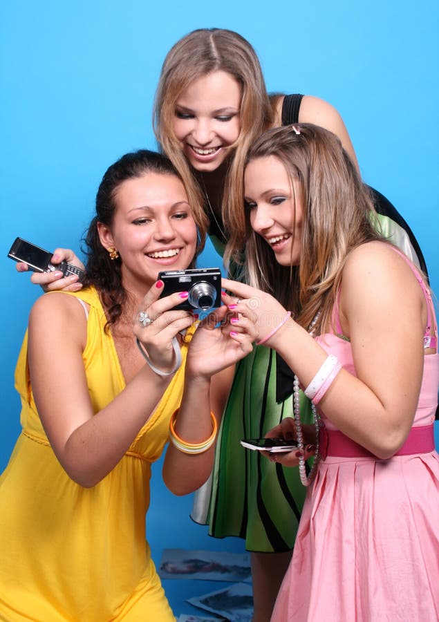 Three girls having fun with a camera