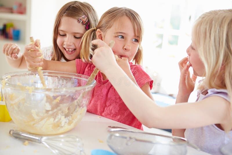 Three Girls Making Cupcakes in Kitchen Stock Ph